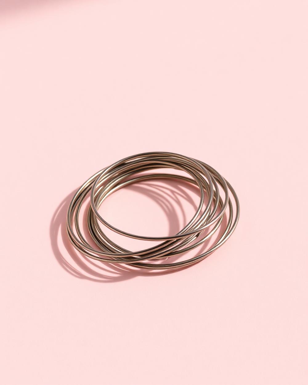 Oxidised silver bangles stacked on a wrist